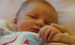 Low-income families receive new baby grant