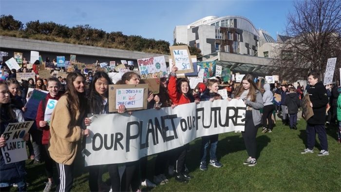 Hundreds gather outside Scottish Parliament for school climate strike