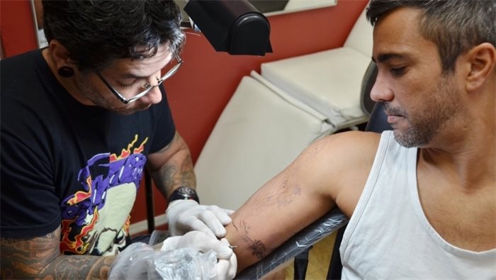 Illegal to refuse tattoos to people with HIV