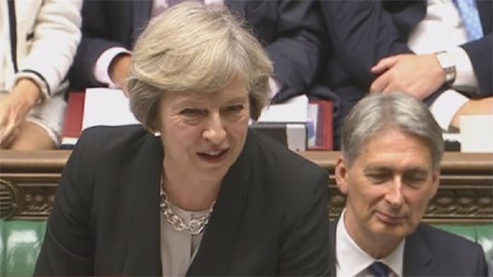 Theresa May attacked on 'xenophobic language' on foreign workers at PMQs