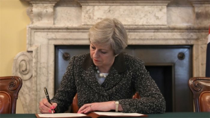 Theresa May signs off Brexit letter with a call for unity