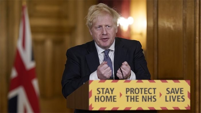 How can Boris Johnson call his government's response to COVID-19 a success?