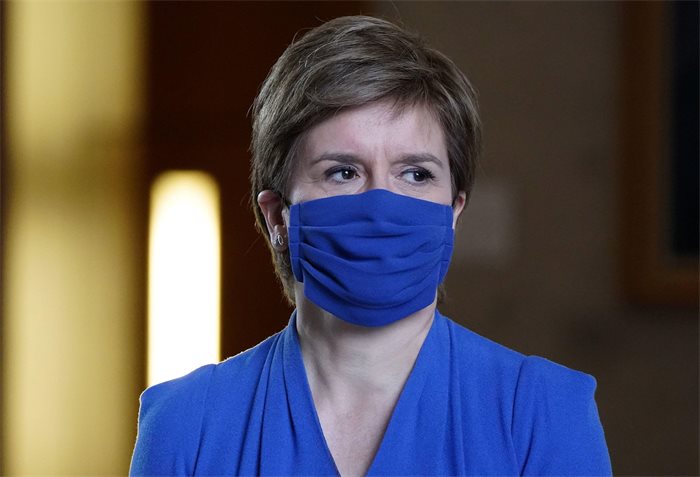 First Minister Nicola Sturgeon says face masks and other COVID measures will be required ‘for some time’