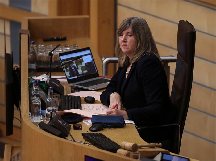 Scottish Parliament apologises after woman asked to leave meeting for wearing suffragette scarf