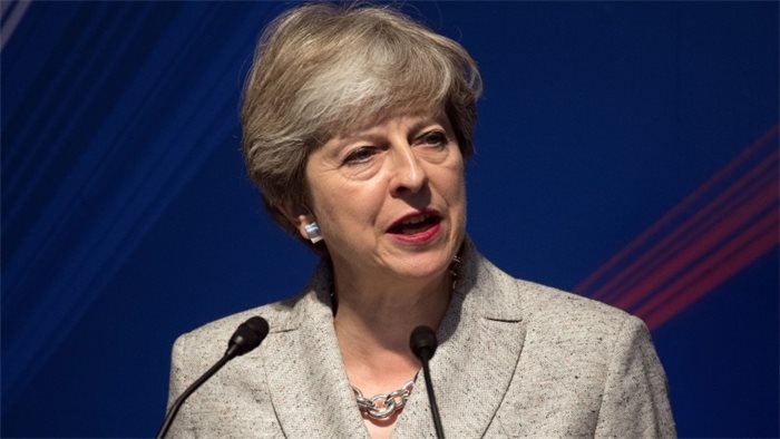 Online abuse is deterring women from entering politics, Theresa May warns