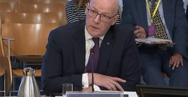 Swinney on the spot: A solemn FM brings his serious face to MSP grilling