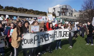 Hundreds gather outside Scottish Parliament for school climate strike